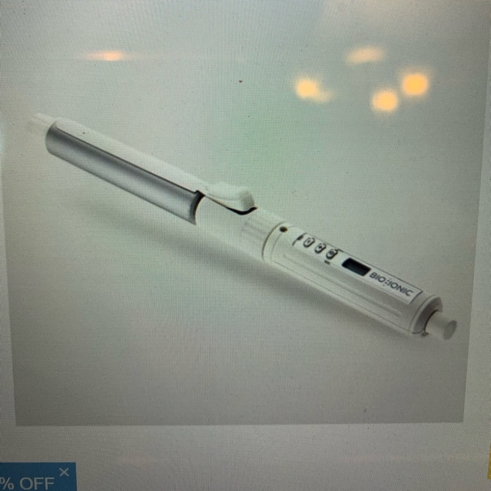 Bio Ionic stylewinder rotating  styling iron. Comes in box.